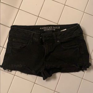 Black fringy denim shorts - low rise